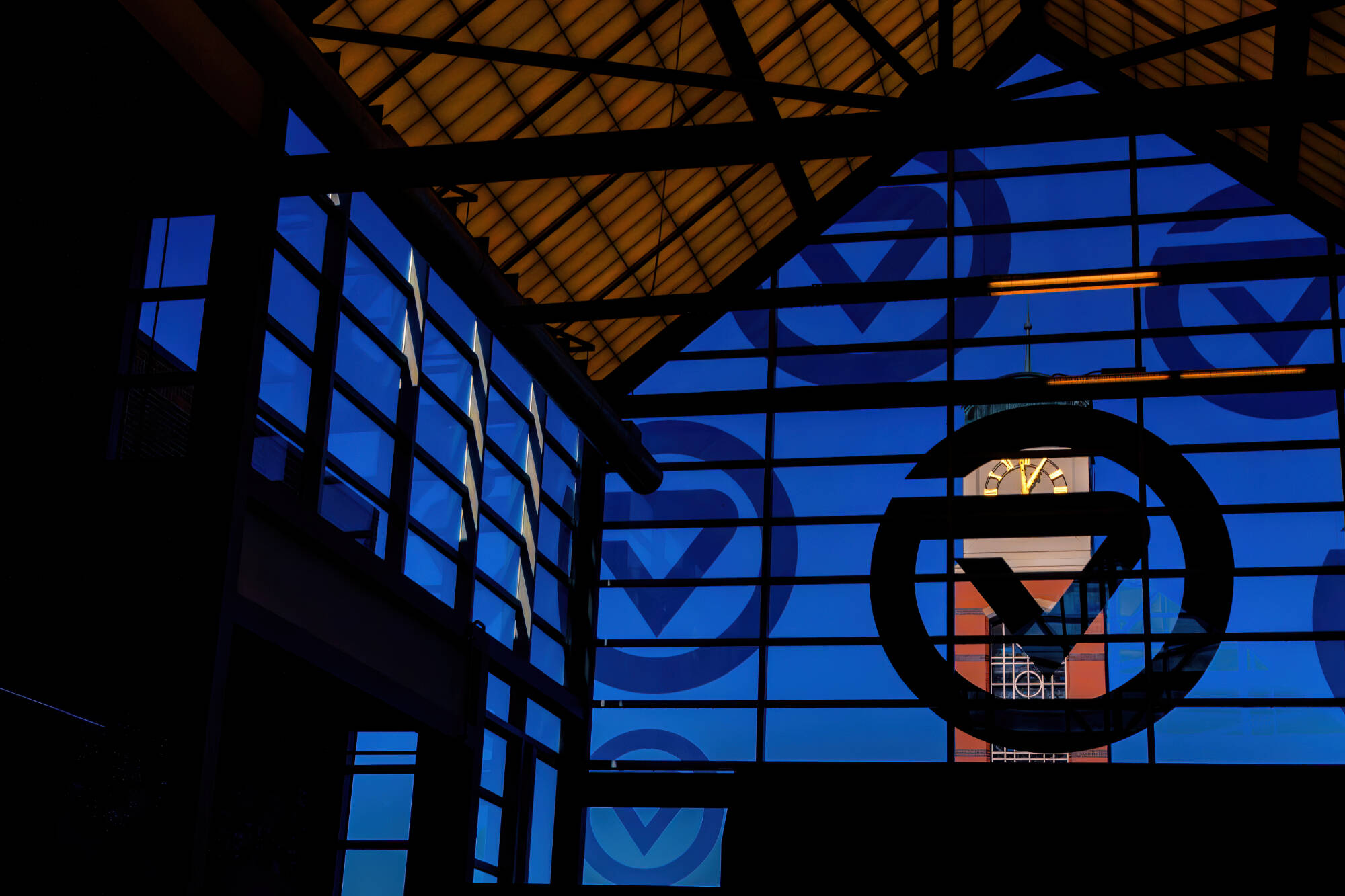 Cook Carillon Tower seen through glass of Kirkhof Center entryway.